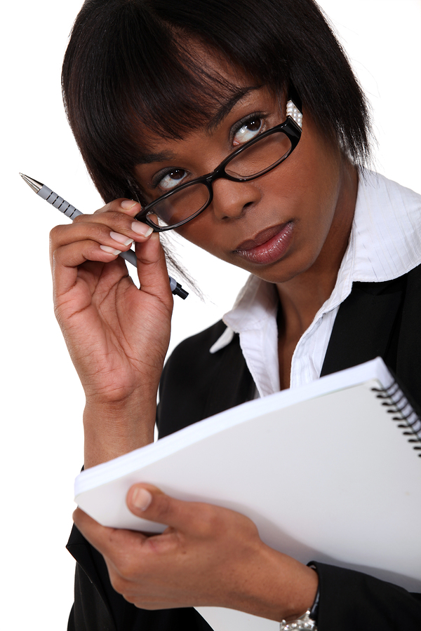 Afro-American businesswoman holding a notepad