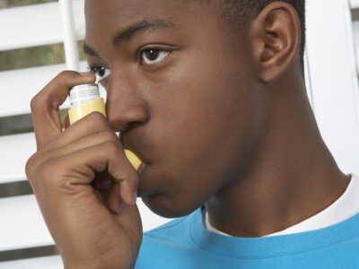Asthma: African American boy with inhaler