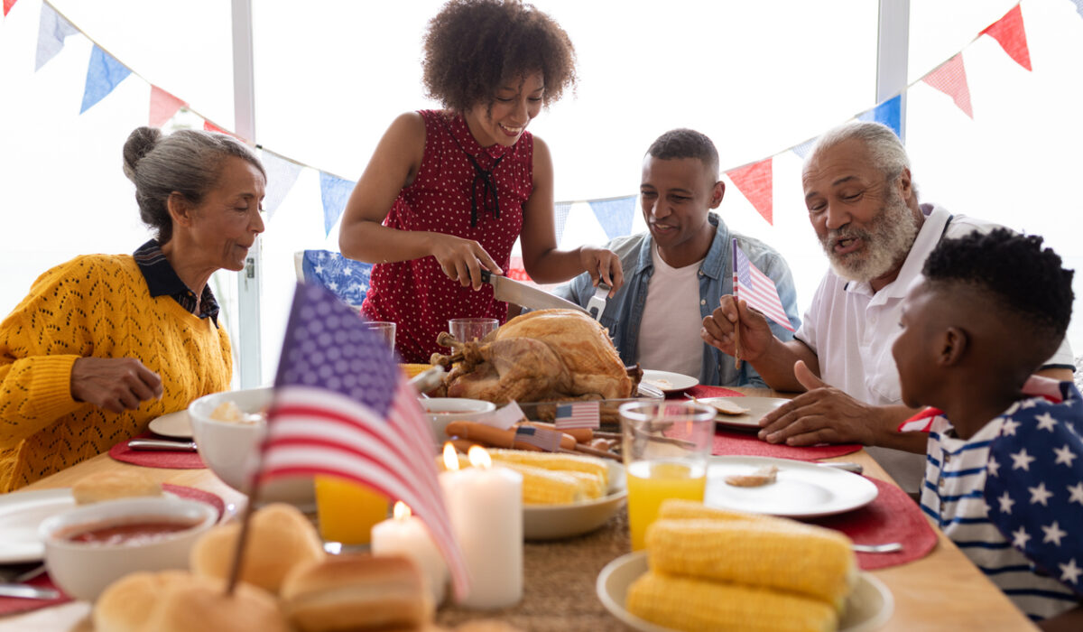 Multigenerational African American Family sitting at table on July 4th